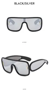 Detail view of trendy futuristic shield sunglasses, large black frame with silver lens.