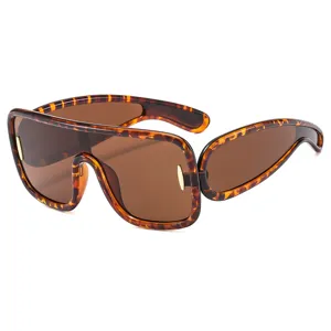 Oversized futuristic tortoise shell wrap-around sunglasses for cyber style fashion main.