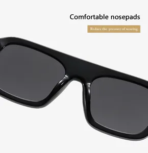 Detailed view of trendy black square sunglasses with comfortable nosepads for daily fashion wear.
