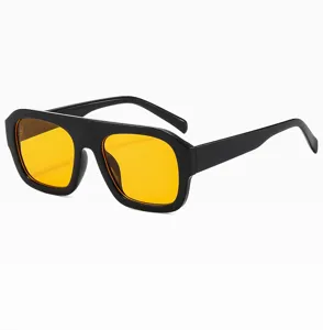Trendy flat top sunglasses with bold black frames and vibrant yellow lenses for women.