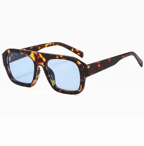 Detailed view of trendy tortoise shell square sunglasses with light blue lenses for women fashion.