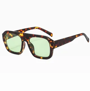 Trendy flat top sunglasses with tortoise shell bold frame and light green lenses for women.