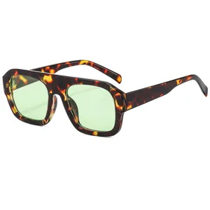 Oversized square sunglasses for women, tortoise shell frame with light green anti-UV lenses.