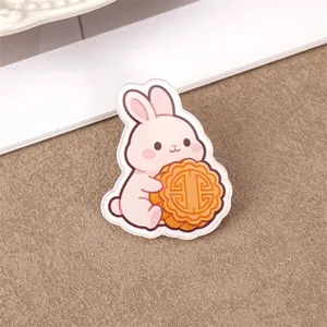 Cute rabbit acrylic brooch badge featuring mooncake design for backpacks and gifts.