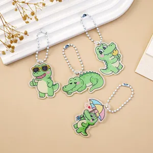 Cute acrylic cartoon crocodile keychain with white bead chain for cute bag charms.