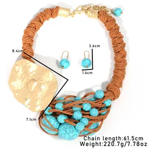 Bohemian hand-woven necklace set with turquoise beads and hammered gold-tone pendant.