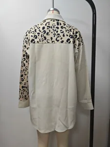 Detailed back view of a women's mid-length cream shirt jacket with leopard print panel.