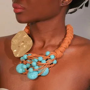 Ethnic turquoise beaded necklace with handmade woven cord and gold alloy pendant