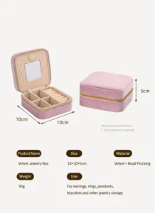 Detailed view of square pink velvet jewelry box with internal ring slots and vanity mirror