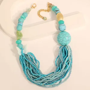 Bohemian multi-layer necklace with turquoise beads and blue multi-strand fringe detail