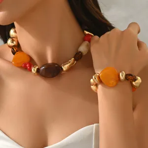 Close-up detail of a vibrant dopamine style resin bead necklace and bracelet set on model