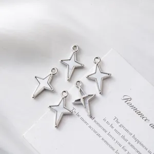 Detailed macro view of silver star charms with white shell inlay for DIY jewelry design