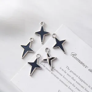 Detailed view of silver-plated black enamel star-shaped pendants for DIY jewelry.
