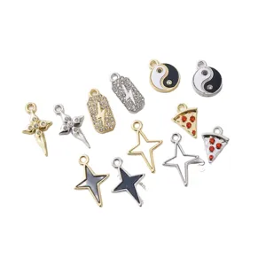Assorted rhinestone charms including cross, star, lightning, pizza, and yin yang