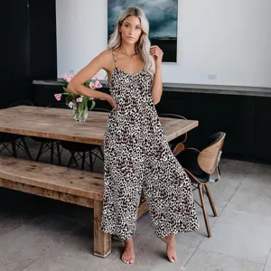 Elegant women's leopard print wide-leg jumpsuit with sexy spaghetti straps for summer wear.