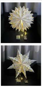 White paper star lantern with LED lights, battery box and remote control for holiday decor.