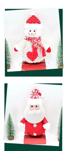 Christmas knitted snowman and Santa Claus doll gift bags for holiday party decor and apple packaging.