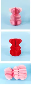 Honeycomb paper bear ornament details, creative party table decoration display.