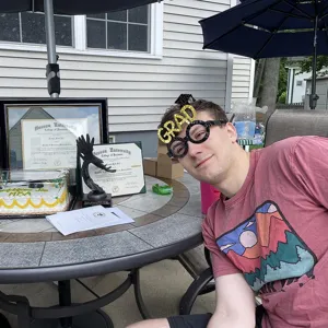 Graduation party photo props black glitter glasses for celebration and photography.