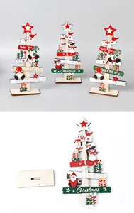 Mini wooden Christmas tree desktop ornament detail view, festive table decor with base and sign.
