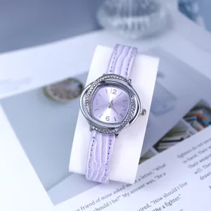 Detail view of women quartz watch featuring purple leather strap and rhinestone bezel design.