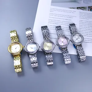 Women quartz watch with rhinestone floral dial and metallic link strap fashion casual timepiece.