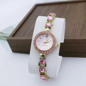 Luxe dames quartz horloge met roze kristal strass armband en elegante wijzerplaat.