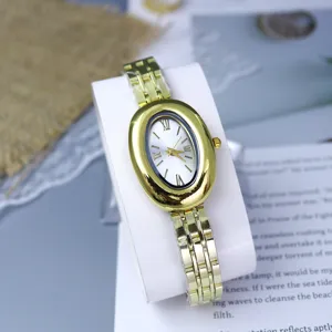 Vintage oval gold watch for women, elegant pigeon egg metal strap wristwatch, fashion gift.