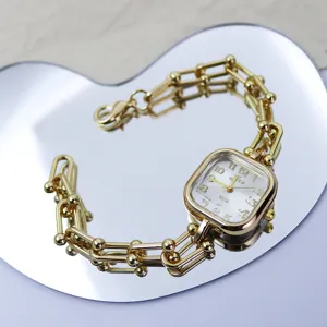 Luxury gold square watch for women, stylish link bracelet design with clear dial and quartz movement.
