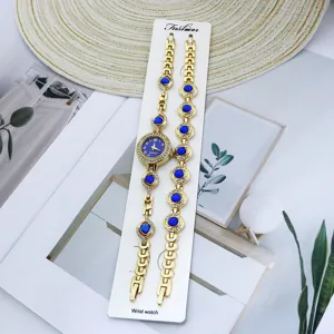 Ensemble montre bracelet quartz femme avec pierres de cristal bleu et design de chaîne dorée.