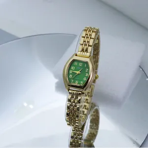 Small green dial gold bracelet quartz watch for women, elegant fashion daily wristwatch.