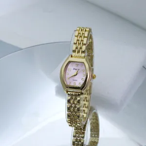 Elegant womens quartz watch with pink tonneau dial and gold metal bracelet detail view