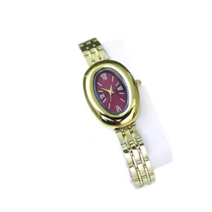 Vintage oval gold women watch with burgundy dial and Roman numerals elegant steel bracelet.