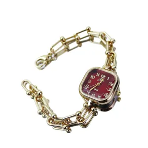 Luxury square women watch with red dial and gold linked bracelet design, elegant stylish.