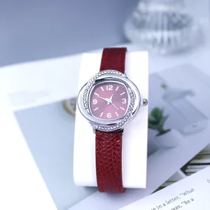 Women fashion quartz watch with red leather strap and rhinestone swirl bezel for daily wear