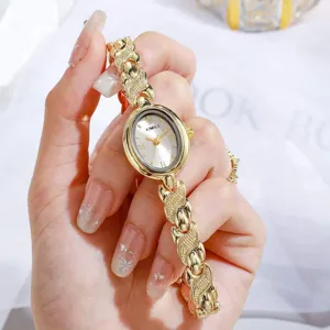 Montre quartz ovale vintage pour femme avec bracelet chaîne or élégant, chic et mode.