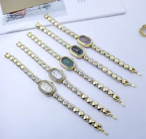 Vintage Strass Damen Uhr ovale goldene Armbanduhr, elegante kleine Quarz Armbanduhr.