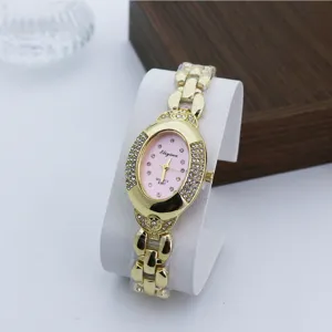 Reloj de cuarzo ovalado vintage para mujer con pedrería brillante, esfera rosa y diseño.