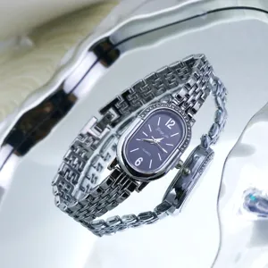 Elegant oval rhinestone quartz women watch with silver metal strap, vintage fashion wristwatch.