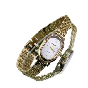 Elegant women's oval rhinestone quartz watch with vintage gold metal link strap for daily wear.