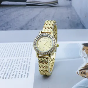 Elegant gold quartz watch for women featuring sparkling rhinestones and a stylish wavy metal band.