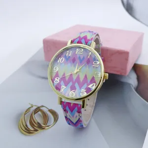 Colorful zigzag pattern quartz watch with gold bezel and large numbers for women fashion.