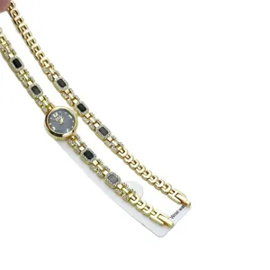 Damen Quarz Mode Armbanduhr mit glitzernden Kristallen und eleganter goldener Metallkette.