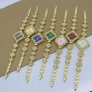 Montre à Quartz pour Femme avec Trèfle à Quatre Feuilles et Strass Montre Bracelet en Alliage avec Boîtier en Forme de Fleur Montre-Bracelet Élégante