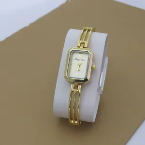 Gold tone rectangular quartz watch for women, delicate hollow bracelet strap, chic casual style.