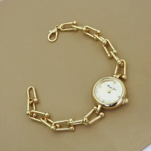 Women gold chain quartz watch elegant fashion wristwatch with U-shaped links design detail view