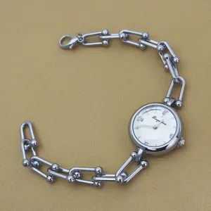 Silver chain watch for women, stylish U-link bracelet wristwatch with round white dial.