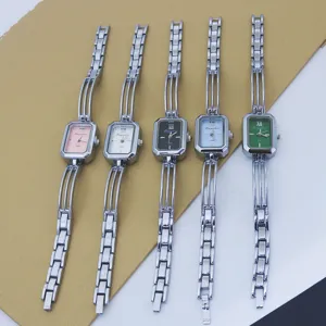 Women fashion quartz watch with slim metal bracelet strap and elegant rectangular dial design.