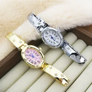 Close-up detail of luxury oval quartz wristwatches with Roman numerals and rhinestone straps.