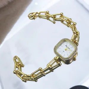 Luxury gold chain bracelet quartz watch with square rhinestone dial for women vintage style.